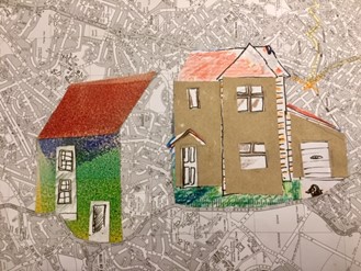 Artwork showing a house collage positioned on a street map.