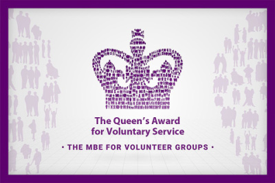 Logo in purple showing a crown and the wording 'The Queen's Award for Voluntary Service' The MBE for voluntary groups'