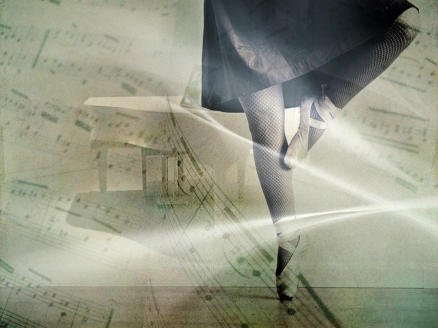 A pair of legs in ballet shoes in front of an image of a piano and sheet music.