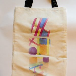 A Person Holding a Rainbow Tote Bag · Free Stock Photo