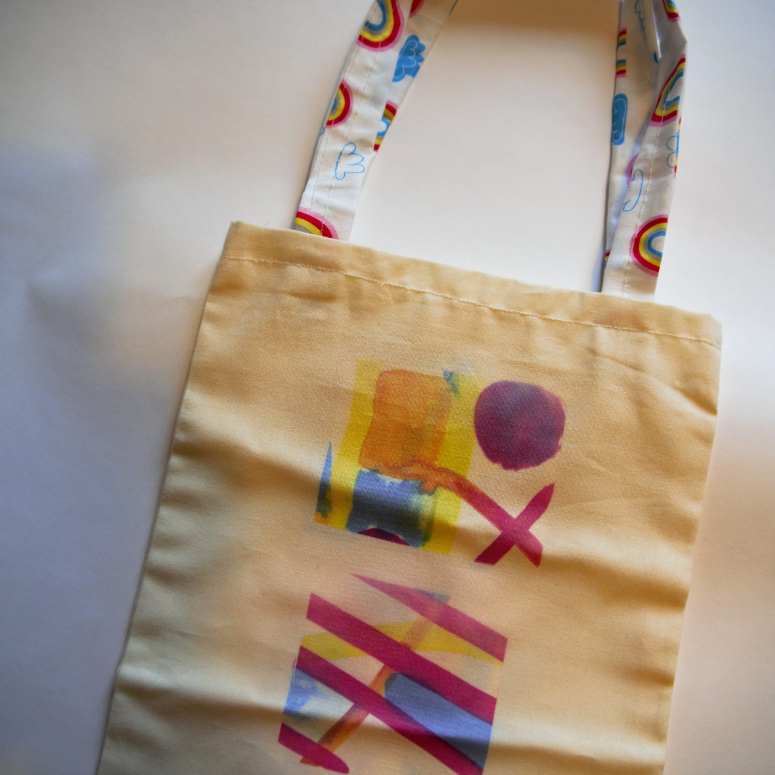 A Person Holding a Rainbow Tote Bag · Free Stock Photo