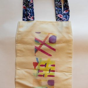 A Person Holding a Rainbow Tote Bag · Free Stock Photo